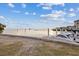 Waterfront views, featuring a boat docked at the property's private pier at 504 Driftwood E Dr, Palm Harbor, FL 34683