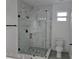 Elegant bathroom featuring a sleek glass shower and marble tiled walls adding style to this relaxing space at 5730 66Th Ln N, St Petersburg, FL 33709