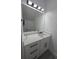 Bathroom with quartz countertops, modern fixtures, and a neutral color palette at 5730 66Th Ln N, St Petersburg, FL 33709