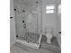 Modern bathroom featuring a frameless glass shower with mosaic tile floor and sleek fixtures at 5730 66Th Ln N, St Petersburg, FL 33709