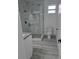 Elegant bathroom showcasing a sleek glass shower, marble tiled walls, and modern fixtures creating a spa-like atmosphere at 5730 66Th Ln N, St Petersburg, FL 33709
