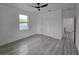 Spacious bedroom with modern ceiling fan and closet at 5730 66Th Ln N, St Petersburg, FL 33709