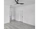 Bedroom featuring white wood look floors and ceiling fan at 5730 66Th Ln N, St Petersburg, FL 33709