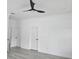 Bedroom with hardwood floors and ceiling fan at 5730 66Th Ln N, St Petersburg, FL 33709