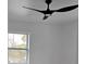 Bedroom featuring a modern ceiling fan and bright window at 5730 66Th Ln N, St Petersburg, FL 33709
