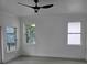 Bright bedroom featuring recessed lighting, light gray flooring and white trim throughout at 5730 66Th Ln N, St Petersburg, FL 33709