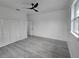 Bright bedroom featuring modern ceiling fan and closet, enhanced by neutral decor at 5730 66Th Ln N, St Petersburg, FL 33709