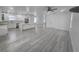 Open floor plan with a large center island and hard surface flooring throughout at 5730 66Th Ln N, St Petersburg, FL 33709