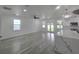 Open floor plan with backyard access, a large center island and hard surface flooring throughout at 5730 66Th Ln N, St Petersburg, FL 33709