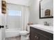 Bright bathroom features white subway tile, shower-tub combo, modern vanity, and stylish decor at 6154 36Th N Ave, St Petersburg, FL 33710