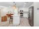 Bright, open kitchen with white cabinets, island, and stainless steel appliances at 6154 36Th N Ave, St Petersburg, FL 33710