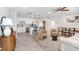 Open-concept living space with modern furnishings, seamlessly blending kitchen, living, and dining areas at 6154 36Th N Ave, St Petersburg, FL 33710
