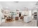 Open-concept living area with an island, seamlessly connecting the kitchen, dining, and living spaces at 6154 36Th N Ave, St Petersburg, FL 33710