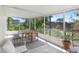 Sunroom with neutral outdoor furniture, tropical plants and lots of natural light at 6154 36Th N Ave, St Petersburg, FL 33710