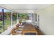 Screened-in porch offering tropical views, outdoor seating, and a relaxing space at 6154 36Th N Ave, St Petersburg, FL 33710