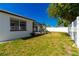 A white vinyl fence surrounds a home's backyard lawn at 6311 Seabreeze Dr, Port Richey, FL 34668