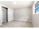 Cozy bedroom featuring a large closet with sliding doors and bright light from the window at 6311 Seabreeze Dr, Port Richey, FL 34668