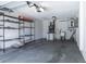 Garage interior featuring painted floors and wire shelving at 6311 Seabreeze Dr, Port Richey, FL 34668