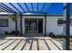 Covered patio with pavers and sliding glass doors leading into the home at 6311 Seabreeze Dr, Port Richey, FL 34668