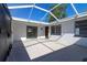 Screened patio area perfect for entertaining or relaxing, with bright light and tiled floors at 6311 Seabreeze Dr, Port Richey, FL 34668