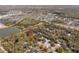 Overhead view of a wooded homesite, with community and commercial areas nearby at 6718 Watson Rd, Riverview, FL 33578