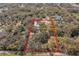 Wooded property lines highlighted in an aerial view of acreage with potential homesite at 6718 Watson Rd, Riverview, FL 33578