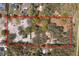 Large acreage lot with mature trees and a building highlighted by a red border and surrounding neighborhood at 6718 Watson Rd, Riverview, FL 33578