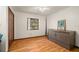 Bedroom with wood floors, a ceiling fan, and a large storage cabinet at 6718 Watson Rd, Riverview, FL 33578