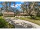 Charming home with detached two car garage, long driveway, and mature trees covered in Spanish moss at 6718 Watson Rd, Riverview, FL 33578