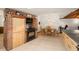 Spacious kitchen leading to dining area with brick features and natural light at 6718 Watson Rd, Riverview, FL 33578