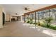 Wide sunroom overlooking private backyard with ample lighting and space at 6718 Watson Rd, Riverview, FL 33578