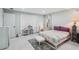 This bedroom features light walls, a bed with purple pillows, and built in closet storage at 7094 Fairway Bend Cir # 7094, Sarasota, FL 34243