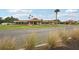 Beautiful community clubhouse with lush landscaping, attractive architecture, and well-maintained grounds at 7094 Fairway Bend Cir # 7094, Sarasota, FL 34243