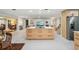 Bright, open-concept kitchen featuring a large center island and stainless steel appliances at 7094 Fairway Bend Cir # 7094, Sarasota, FL 34243