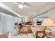 Bright living room with neutral walls, showcasing ample space and comfortable seating arrangements at 7094 Fairway Bend Cir # 7094, Sarasota, FL 34243