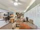 Large, bright living area features an open layout connecting the living, dining, and kitchen spaces at 7094 Fairway Bend Cir # 7094, Sarasota, FL 34243