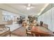 Open-concept living area with light-colored walls, combining living, dining, and kitchen spaces at 7094 Fairway Bend Cir # 7094, Sarasota, FL 34243