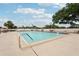 Large outdoor community pool surrounded by ample seating, perfect for relaxation and recreation at 7094 Fairway Bend Cir # 7094, Sarasota, FL 34243