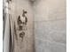 A stylish, tiled shower features modern fixtures and a convenient shelving unit at 7094 Fairway Bend Cir # 7094, Sarasota, FL 34243
