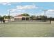 Well-maintained tennis court with lighting, offering residents a great recreational amenity at 7094 Fairway Bend Cir # 7094, Sarasota, FL 34243