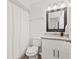 Cozy bathroom featuring a vanity with granite countertop and a shower/tub combo at 7134 2Nd N St, St Petersburg, FL 33702