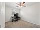 Bright bedroom with neutral carpet, ceiling fan, and window overlooking the front yard at 7134 2Nd N St, St Petersburg, FL 33702