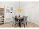 This pleasant dining area offers tile flooring, modern lighting, and staircase access at 7134 2Nd N St, St Petersburg, FL 33702