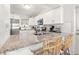 Open kitchen with granite countertops, stainless steel appliances, and a breakfast bar at 7134 2Nd N St, St Petersburg, FL 33702