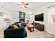 This comfortable living area is bright, featuring tile floors, fireplace, and a view to the kitchen at 7134 2Nd N St, St Petersburg, FL 33702