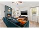 This bright living room is designed with a vaulted ceiling, fireplace, and tile floors at 7134 2Nd N St, St Petersburg, FL 33702