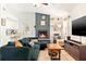 Inviting living room featuring a cozy fireplace, modern decor, and comfortable furnishings at 7134 2Nd N St, St Petersburg, FL 33702
