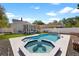 Sparkling pool and spa surrounded by a concrete patio at 7134 2Nd N St, St Petersburg, FL 33702