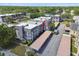 Aerial view highlights the building's location, close to covered parking and surrounded by lush greenery at 8703 Bardmoor Blvd # 203, Seminole, FL 33777