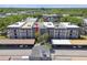 Aerial view showcases building featuring well-maintained roof, and ample parking at 8703 Bardmoor Blvd # 203, Seminole, FL 33777